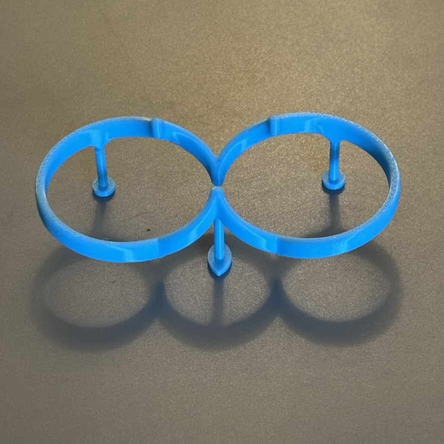 Printed impossible object with a light shone from behind at 45 degrees, casting the opposite silhouette as a shadow
